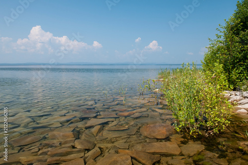 Landscape view of lake Uvildy with its rocky shoreline and clear water, South Ural, Russia