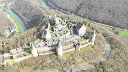 Drone flyover over stone ruins of Bourscheid Castle