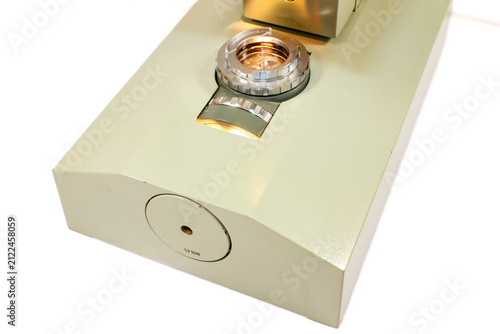 Obraz na płótnie Macro detail of a microscope base with built-in light source and optical illuminator used for laboratory research, biology and education