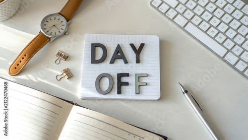 Obraz na plátně Day off concept sign on office desk with planner and keyboard, vacation
