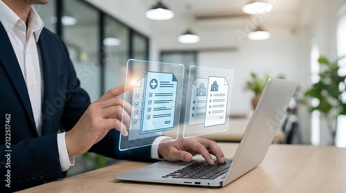 Person using laptop with digital document interface