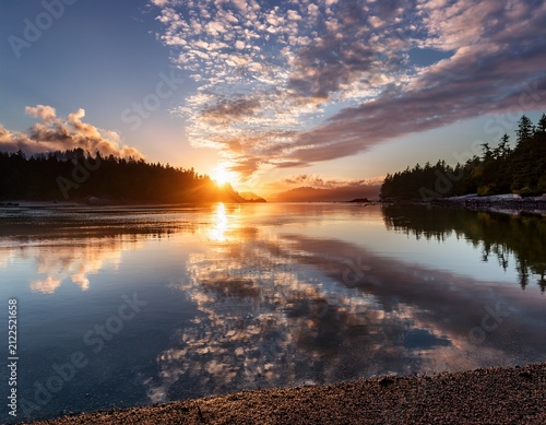 amazing sunrise cloud reflection along the ocean in kye bay on vancouver island british columbia canada