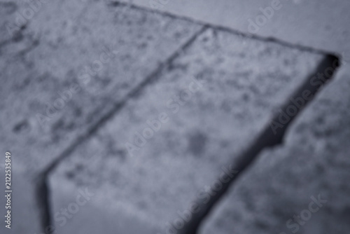 Fotografie Defocused concrete blocks with cool tones and soft shapes, ideal for abstract construction themes, industrial mood, uncertainty, transition, and conceptual design