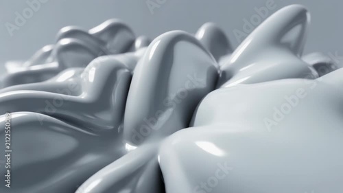 Abstract glossy white and silver liquid forms twist into soft flowing folds, creating a smooth futuristic background with reflective organic shapes and fluid sculptural texture