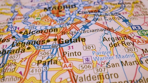 road network to madrid, spain, gliding macro view over atlas map