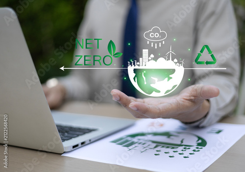 Business leaders display environmental symbols representing goals including ESG, CO2, circular economy, and net-zero greenhouse gas emissions. Environment, Sustainability, Recycling, Green Energy