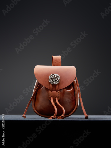 Handcrafted Brown Leather Pouch with Intricate Silver Celtic Knot Accessory