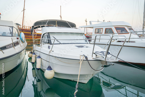 Canvastavla White motorboats and yachts docked in a calm marina at twilight