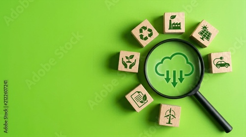 Environmental audit concept with loupe showing green emissions cloud over wooden sustainability cubes
