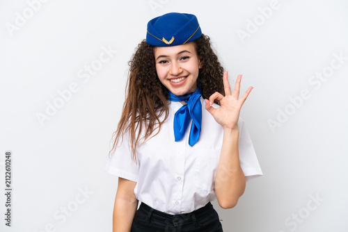 Foto Airplane stewardess Arab woman isolated on white background showing ok sign with