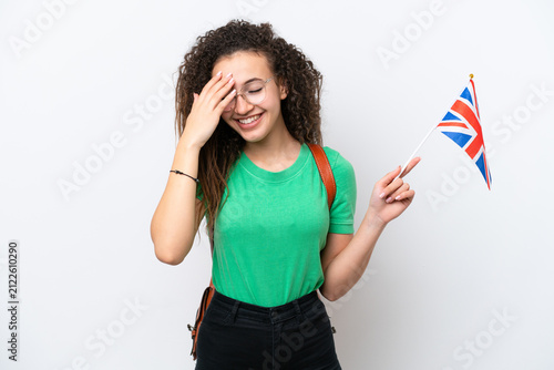 Fotografie Young Arab woman holding an United Kingdom flag isolated on white background lau