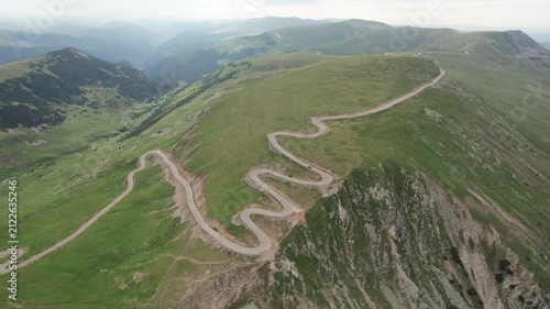Aerial view of the winding Transalpina road in the Carpathian Mountains on a summer morning