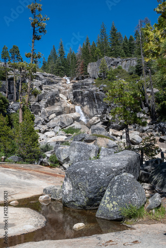 Bassi Falls flows over rocks in forest setting,  Eldorado National Forest, California, USA
