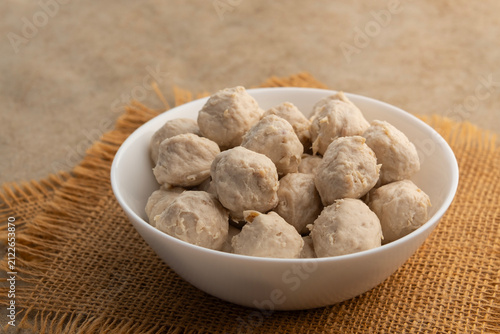 Pork tendon meatballs in white bowl.(Thai Pork Tendon Balls)