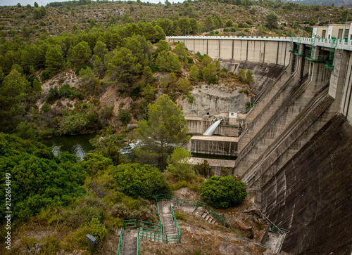 Obraz na plátne Comprehensive view of Beniarres hydro dam with water release and green landscape