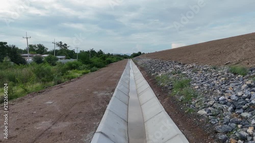 Cement canals are used to drain water from high roadsides in rural areas.