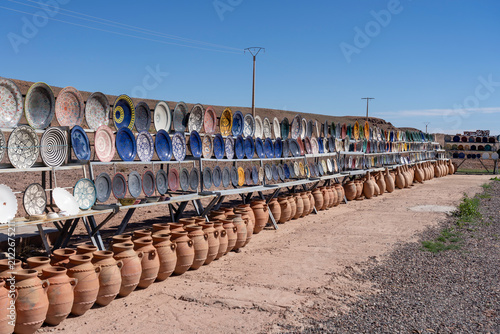 Plates, tajines and pots displayed and ready for sale at an roadside outdoor pottery marke
in Morocco.
