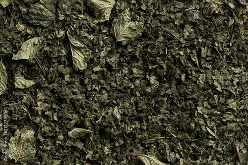 Background Texture of Crushed Organic Dried Mint Leaves