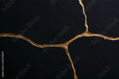 Black Marble Kintsugi Pattern with Golden Cracks Texture Background