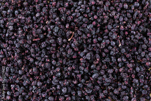 Close Up Texture Background of Dried Black Barberry Fruits Spices