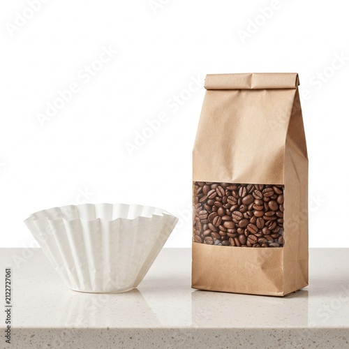 Roasted coffee beans in brown paper bag with window, white paper coffee filter on marble counter, minimalist cafe branding mockup