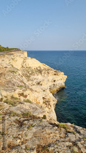 Cuadro en lienzo Rocky sea cliffs overlooking calm blue Mediterranean water with copy space