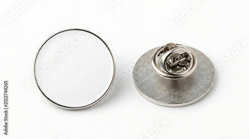 Two blank round metal lapel pins with white enamel