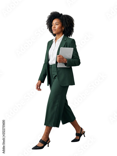 African American businesswoman in green suit walking holding tablet computer