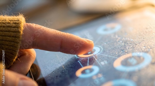 Close up of finger interacting with digital data on tablet