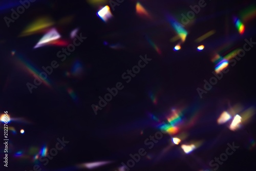 Quadro su tela Blur colorful rainbow crystal light leaks on black background