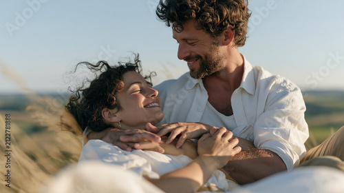 A couple sits together on a hillside abo 4