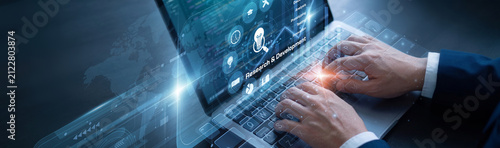Obraz na plátně Tech lead is diligently managing new files using laptop for the Research & Development systems network protocols to ensure absolute data growth
