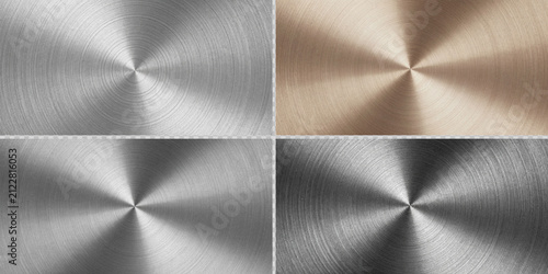 A circular, polished metal plate with a subtle radial brushed finish, featuring four evenly spaced, countersunk holes
