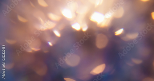 Blur kaleidoscope flare. Light abstraction. Purple neon orange colorful optical gleam circle on luminous bokeh glisten art background.