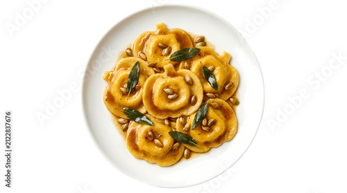 Pumpkin shaped ravioli with pumpkin seeds and sage leaves on white plate food photography.
