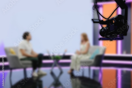 Foto Overhead TV camera filming two guests in talk show studio