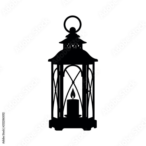 Black silhouette of a decorative lantern with a lit candle inside