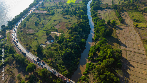 Obraz na plátne An aerial drone view captures a severe traffic jam stretching across a bridge over the Pakthoay River in Laos after a road accident caused major disruptions and long delays for motorists