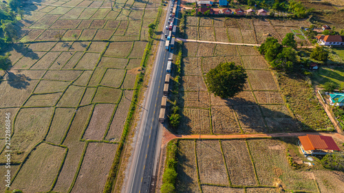 Принти на полотні Vehicles line up for kilometers on both sides of the bridge as emergency responders work to clear a collision that temporarily halted traffic flow in the rural countryside