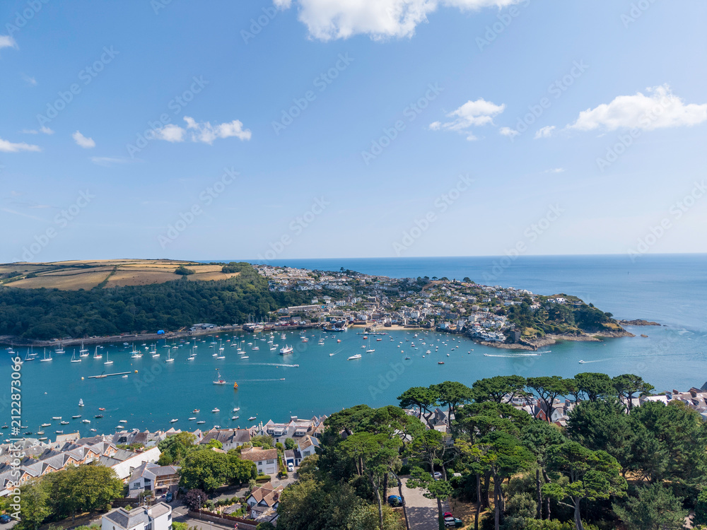 Fototapeta premium Aerial views of a coastal town, holiday campsite, marina, harbour, beach and surrounding countryside