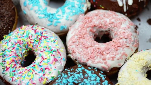 Colourful Glazed Donuts Assortment Rotating Close Up 4K Macro Sweet Dessert Pastry Background