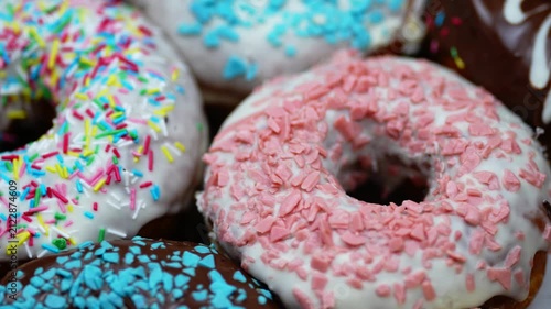 Colourful Glazed Donuts Assortment Rotating Close Up 4K Macro Sweet Dessert Pastry Background