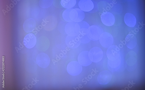 Abstract background with blurred bokeh lights in shades of blue, purple, and pink, creating a dreamy, soft atmosphere. lights add a festive, artistic feel, perfect for conceptual themes.