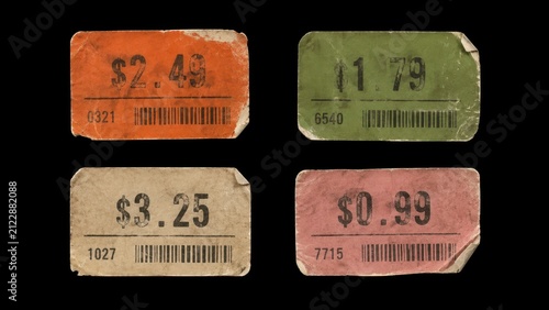 Set of four worn vintage price stickers isolated on black