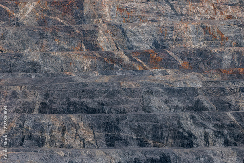Obraz na płótnie Close up quarry wall texture background with layered rock strata for industrial