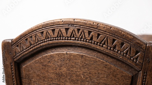 Fotografie Close up of an ornate carved wooden chair backrest