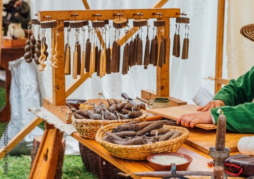 Картината върху платно Medieval Candle Maker Production With Handcrafted Dipped Wax Candles Hanging On