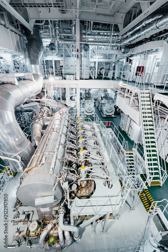 Large Modern Ship Engine Room with Main Diesel Propulsion System and Piping