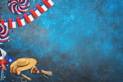 Chile fiestas patrias decorations and traditional toys on a blue background with copy space