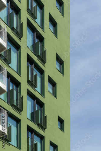 Canvas Print Green modern building facade with residential balconies